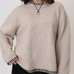 Central Park Grey Bandit Cozy Tan Sweater with Black Trim